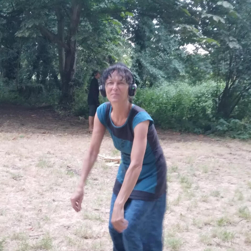 Nicky dancing with headphones in the woods